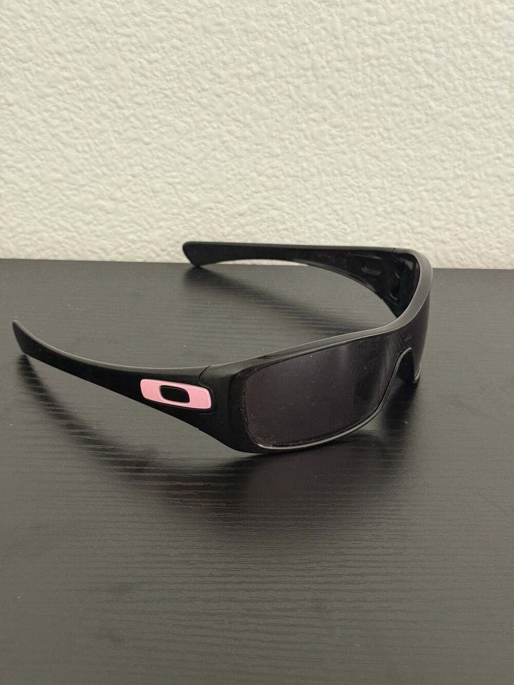 Oakley Antix Sunglasses Matte Black Frame with Pink Icon